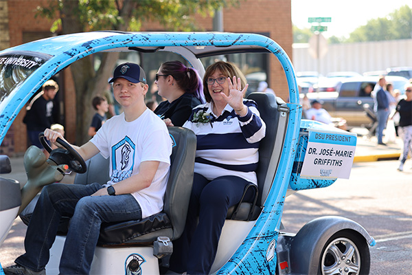 President Griffiths being driven through the 2024 Homecoming Parade.